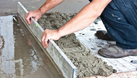 Worker Smoothing Cement